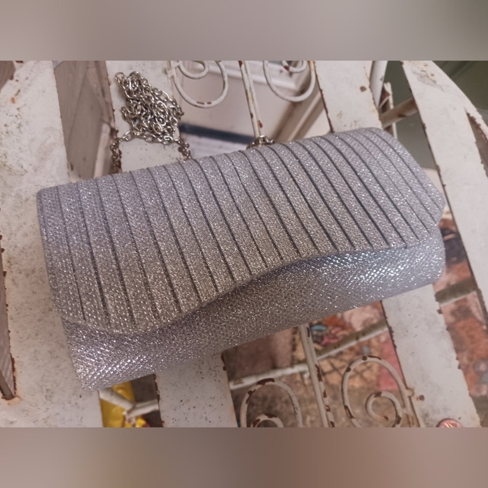 Silver chained clutch.